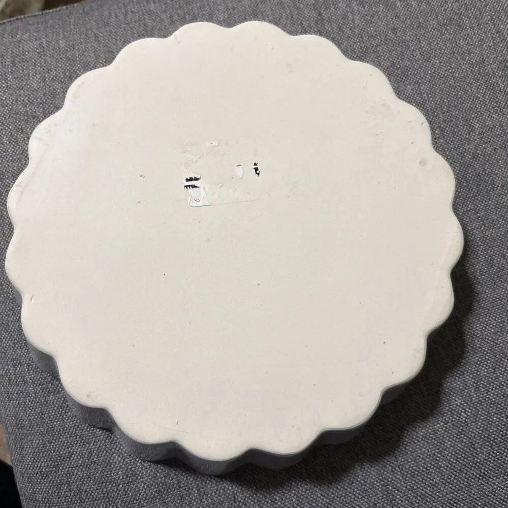 This is a vintage white ceramic quiche or flan baking dish
